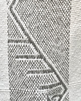 Close-up of zig zag pattern in gray and white fabric